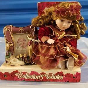 Vintage doll with picture frame.